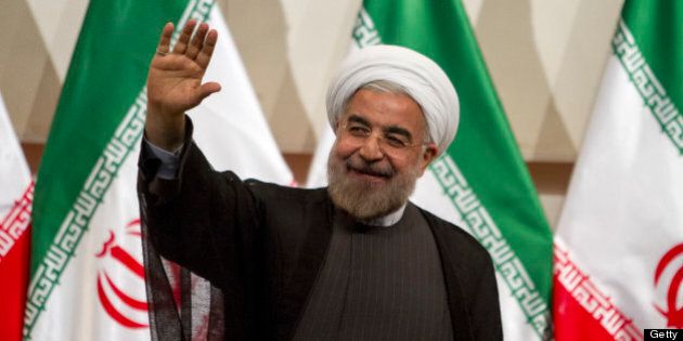 TEHRAN, IRAN - JUNE 17: Iran's president elect Hassan Rouhani waves during his first press conference after being elected on June 17, 2013 in Tehran, Iran. Rouhani expressed hope that Iran can reach a new agreement with major powers over its disputed nuclear program, saying a deal should be reached through more transparency and mutual trust. (Photo by Majid Saeedi/Getty Images)