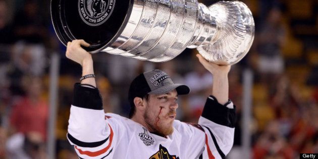 BOSTON, MA - JUNE 24: Andrew Shaw #65 of the Chicago Blackhawks celebrates with the Stanley CUp after they won 3-2 against the Boston Bruins in Game Six of the 2013 NHL Stanley Cup Final at TD Garden on June 24, 2013 in Boston, Massachusetts. (Photo by Harry How/Getty Images)