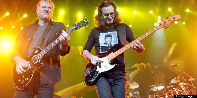 SAN JOSE, CA - NOVEMBER 15: (L - R) Alex Lifeson, Geddy Lee, and Neil Peart of Rush perform part of the bands' Clockwork Angels Tour at HP Pavilion on November 15, 2012 in San Jose, California. (Photo by Tim Mosenfelder/Getty Images)