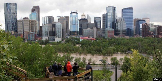 An elevated view of the flooding at Bow River gives lookers a view next to the downtown core, in Calgary, Alberta, Canada June 22, 2013. Water levels have dropped slightly today. AFP PHOTO/DAVE BUSTON (Photo credit should read DAVE BUSTON/AFP/Getty Images)