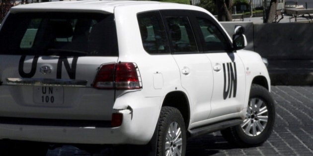 A United Nations vehicle carrying inspectors from the Organisation for the Prohibition of Chemical Weapons (OPCW) leaves a hotel in Damascus on October 11, 2013. The watchdog now overseeing the destruction of Syria's chemical arsenal won the Nobel Peace Prize for its efforts to rid the world of the devastating weapons. AFP PHOTO / JIANG TIEYING (Photo credit should read JIANG TIEYING/AFP/Getty Images)