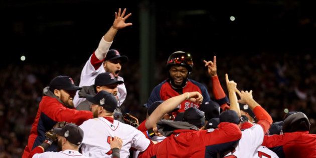 BOSTON, MA - OCTOBER 30: The Boston Red Sox celebrate after defeating the St. Louis Cardinals in Game Six of the 2013 World Series at Fenway Park on October 30, 2013 in Boston, Massachusetts. The Boston Red Sox defeated the St. Louis Cardinals 6-1. (Photo by Rob Carr/Getty Images)