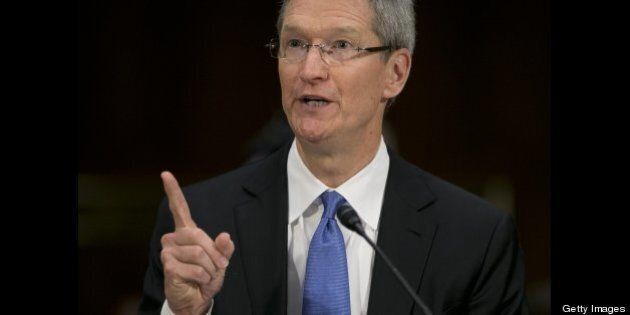 Tim Cook, chief executive officer of Apple Inc., speaks during a Senate Permanent Subcommittee on Investigations hearing in Washington, D.C., U.S., on Tuesday, May 21, 2013. Apple Inc. used 'loopholes' to avoid paying $9 billion in U.S. taxes in 2012, U.S. Senator Carl Levin said. Photographer: Andrew Harrer/Bloomberg via Getty Images