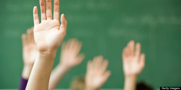 Hands raised in classroom