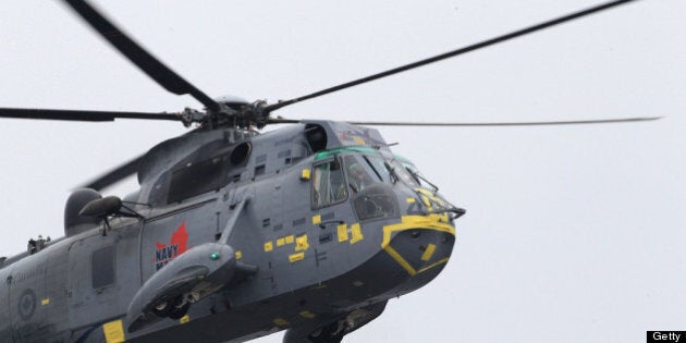 CHARLOTTETOWN, PE - JULY 04: Prince William, Duke of Cambridge takes part in an exercise in a Sea King Helicopter on July 4, 2011 in Charlottetown, Canada. The newly married Royal Couple are on the fifth day of their first joint overseas tour. The 12 day visit to North America is taking in some of the more remote areas of the country such as Prince Edward Island, Yellowknife and Calgary. The Royal couple started off their tour by joining millions of Canadians in taking part in Canada Day celebrations which mark Canada's 144th Birthday. (Photo by Chris Jackson/Getty Images)