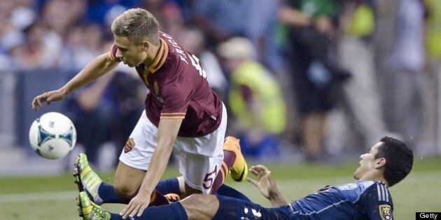 AS Roma forward Federico Ricci and MLS All-Stars defender Tony Beltran, right, collide during the MLS All-Star Game on Wednesday, July 31, 2013, at Sporting Park in Kansas City, Kansas. Roma defeated the MLS squad, 3-1. (John Sleezer/Kansas City Star/MCT via Getty Images)