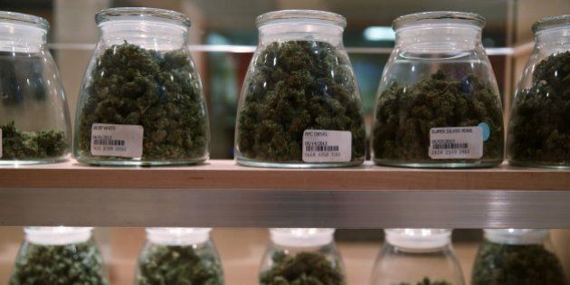 Jars containing various strands of medical marijuana sit behind a display case at the River Rock Medical Marijuana Center in Denver, Colorado, on May 16, 2013. (Anthony Souffle/Chicago Tribune/MCT via Getty Images)