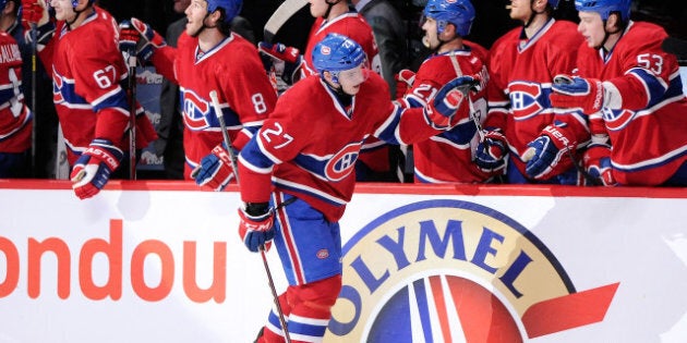 MONTREAL, CANADA - APRIL 4: Alex Galchenyuk #27 of the Montreal Canadiens celebrates his third-period goal with teammates during the NHL game against the Winnipeg Jets at the Bell Centre on April 4, 2013 in Montreal, Quebec, Canada. The Canadiens defeated the Jets 4-1. (Photo by Richard Wolowicz/Getty Images)