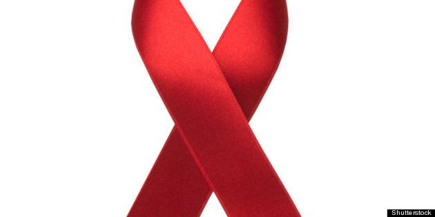 red ribbon as symbol of aids...