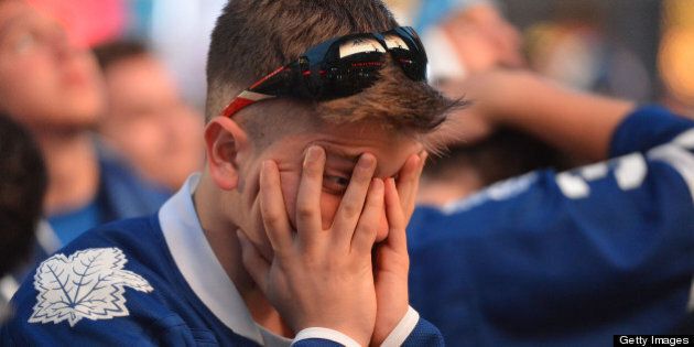 TORONTO, ON - MAY 8: A Toronto Maple Leaf fan reacts after a Boston goal outside the Air Canada Centre the Toronto Maple Leafs play the Boston Bruins. (Carlos Osorio/Toronto Star via Getty Images)