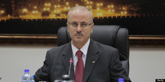 Palestinian Prime Minister Rami Hamdallah chairs the first working meeting of the new Palestinian government in the West Bank town of Ramallah on June 11, 2013. The new government was sworn in on June 6, after the resignation of premier Salam Fayyad in April. AFP PHOTO/ABBAS MOMANI (Photo credit should read ABBAS MOMANI/AFP/Getty Images)