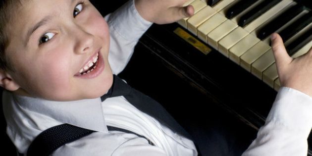 little boy and piano.