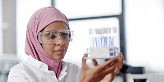woman looking at laboratory samples