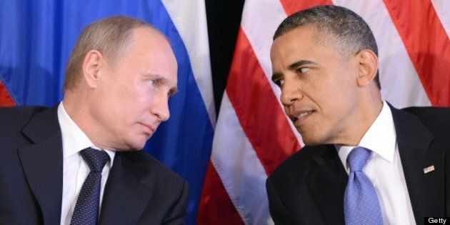 US President Barack Obama (R) listens to Russian President Vladimir Putin after their bilateral meeting in Los Cabos, Mexico on June 18, 2012 on the sidelines of the G20 summit. Obama and President Vladimir Putin met Monday, for the first time since the Russian leader's return to the presidency, for talks overshadowed by a row over Syria. The closely watched meeting opened half-an-hour late on the sidelines of the G20 summit of developed and developing nations, as the US leader sought to preserve his 'reset' of ties with Moscow despite building disagreements. AFP PHOTO/Jewel Samad (Photo credit should read JEWEL SAMAD/AFP/GettyImages)
