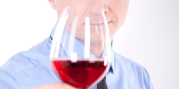 LONDON, ENGLAND - APRIL 16: A judge smells a white wine at the 'International Wine Challenge' event at Lords Cricket ground on April 16, 2012 in London, England. Judges will taste over 10,000 bottles of wine from across the globe, with wines in each category winning either Gold, Silver, Bronze or Commended in the biggest and most important event of its kind in the world. Wines awarded with Gold Medals then go on to be re-tasted in the Trophy Round to decide which may be awarded Champion status. (Photo by Dan Kitwood/Getty Images)