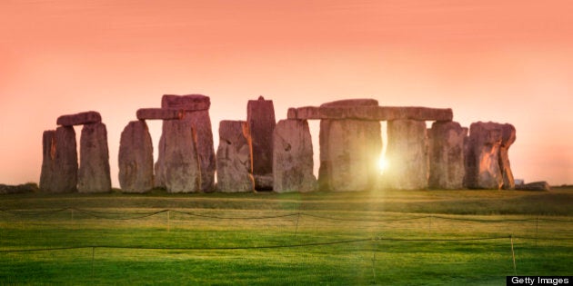 The prehistoric monument of Stonehenge in England. Focus is on the grass.