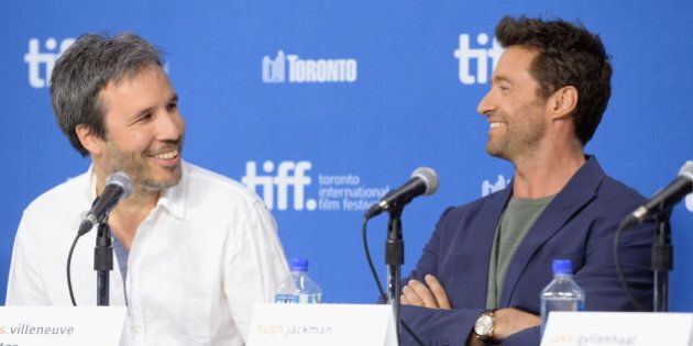 TORONTO, ON - SEPTEMBER 07: (L-R) Director Denis Villeneuve and actor Hugh Jackman speak onstage at 'Prisoners' Press Conference during the 2013 Toronto International Film Festival at TIFF Bell Lightbox on September 7, 2013 in Toronto, Canada. (Photo by Jason Merritt/Getty Images)