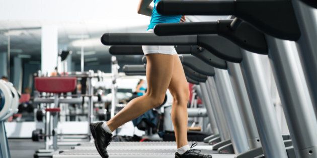 woman running on a treadmill in ...