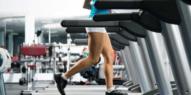 woman running on a treadmill in ...