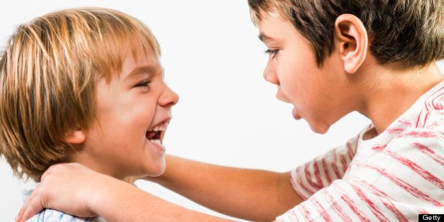 Two boys arguing.