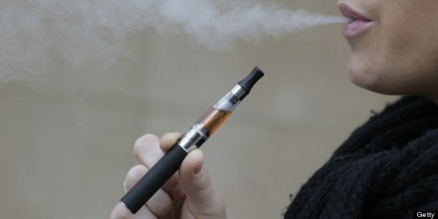 A person smokes an electronic cigarette on March 05, 2013 in Paris. AFP PHOTO / KENZO TRIBOUILLARD (Photo credit should read KENZO TRIBOUILLARD/AFP/Getty Images)