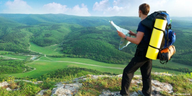 man tourist in mountain read...