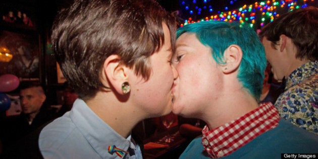 Gay-rights supporters celebrate in a bar in Wellington on April 17, 2013 after New Zealand became the first Asia-Pacific country to legalise same-sex marriage after a decades-long campaign. A parliamentary vote overwhelmingly backed a move to amend the 1955 Marriage Act 77-44 to describe matrimony as a union of two people regardless of their sex, sexuality or how they choose to identify their gender. AFP PHOTO / MARTY MELVILLE (Photo credit should read Marty Melville/AFP/Getty Images)