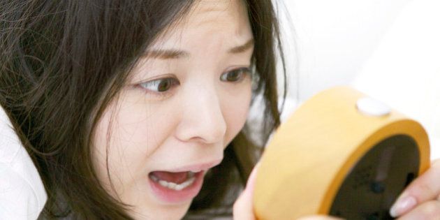 Japanese woman overslept shocking with looking at clock