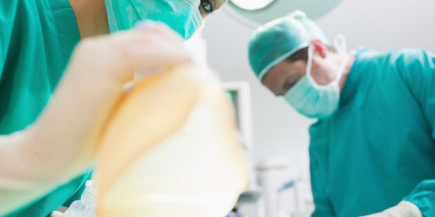 close up of a nurse holding an...