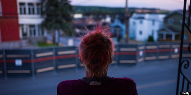 LAC-MEGANTIC, CANADA - JULY 14: Patricia Landry gets her first view of the 'red zone' crash site, on July 14, 2013 in Lac-Megantic, Quebec, Canada. A train derailed and exploded into a massive fire that flattened dozens of buildings in the town's historic district, leaving 60 people dead or missing in the early morning hours of July 6. (Photo by Ian Willms/Getty Images)