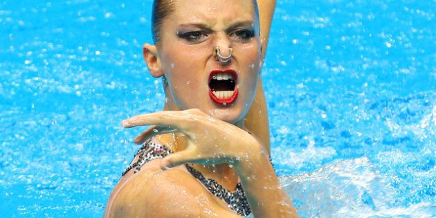 DELHI, INDIA - OCTOBER 07: Chloe Isaac of Canada performs prior to the Solo Free Routine at the Dr.S.P. Mukherjee Aquatics Complex during day four of the Delhi 2010 Commonwealth Games on October 7, 2010 in Delhi, India. (Photo by Ian Walton/Getty Images)