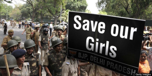 NEW DELHI, INDIA - APRIL 21: Activists of Bharatiya Janata Party shouts anti Government slogans outside the UPA Chairperson Sonia Gandhi's residence during a demonstration against the rape of a five-year old girl on April 21, 2013 in New Delhi, India. A five year girl went missing on April 15 and was found on April 17 in same building where she lives with her parents. She was found in serious condition after being brutally raped and tortured with slashed neck and bite marks on her body. The man who lives in that room was arrested in Bihar state on April 20. (Photo by Vipin Kumar/Hindustan Times via Getty Images)