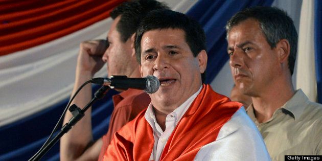 Paraguayan presidential candidate for the Colorado Party, Horacio Cartes, delivers a speech after winning the elections in Asuncion on April 21, 2013. AFP PHOTO/Pablo PORCIUNCULA (Photo credit should read PABLO PORCIUNCULA/AFP/Getty Images)
