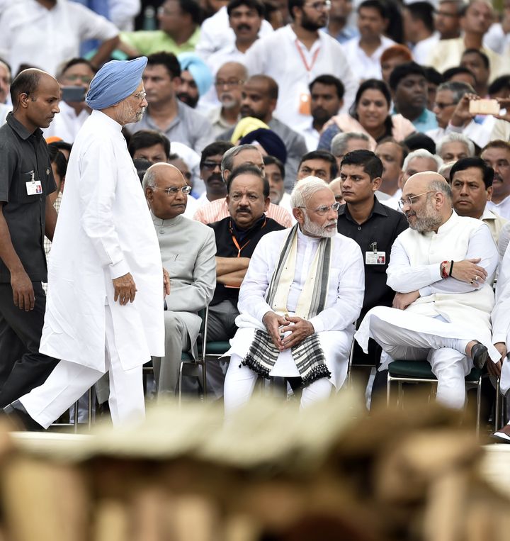 Former Prime Minister (standing), President Ramnath Kovind (Left), Prime Minister Narendra Modi (Middle) and BJP President Amit Shah (Right) in a file photo. 