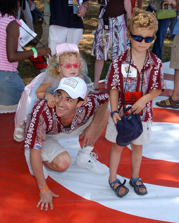 Luke Perry is seen with his daughter Sophie and son Jack at a pediatric AIDS benefit in 2004. Sophie Perry, now 18, has named a preschool in Malawi after him.