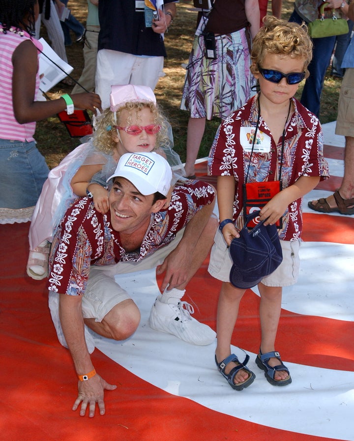 Luke Perry is seen with his daughter Sophie and son Jack at a pediatric AIDS benefit in 2004. Sophie Perry, now 18, has named a preschool in Malawi after him.