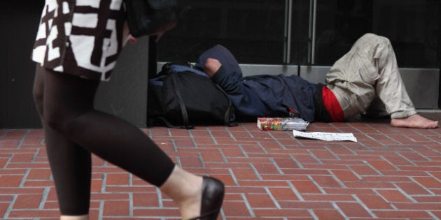 SAN FRANCISCO - SEPTEMBER 16: A homeless man sleeps in the doorway of a closed store on September 16, 2010 in San Francisco, California. The U.S. poverty rate increased to a 14.3 percent in 2009, the highest level since 1994. (Photo by Justin Sullivan/Getty Images)