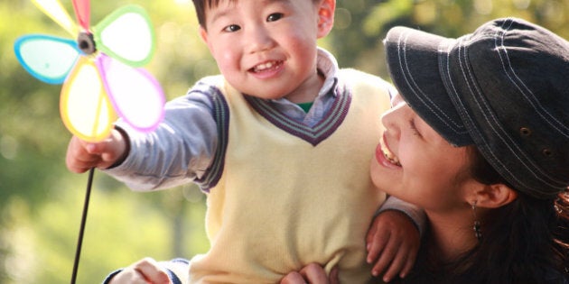 chinese boy and his mother at garden