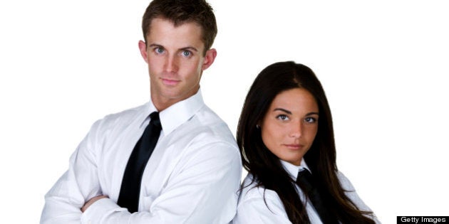 Serious man and woman wearing white shirt and black tie for business concept