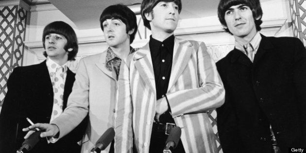 1966: British pop group the Beatles standing in front of four microphones at a press conference where they discussed their concert at Shea Stadium, New York City. L-R: Ringo Starr, Paul McCartney, John Lennon (1940 -1980), and George Harrison (1943 - 2001). (Photo by Santi Visalli Inc./Getty Images)