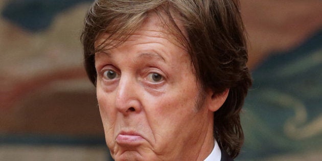 Former Beatles' singer Sir Paul Mc Cartney gives a thumb up after being awarded by French president as officer of the 'Legion d'Honneur' (Legion of honour), the French hightest award on September 8, 2012 at the Elysee presidential palace in Paris. AFP PHOTO / POOL PHILIPPE WOJAZER (Photo credit should read PHILIPPE WOJAZER/AFP/GettyImages)