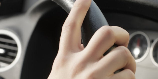 girl hand on wheel steering on...