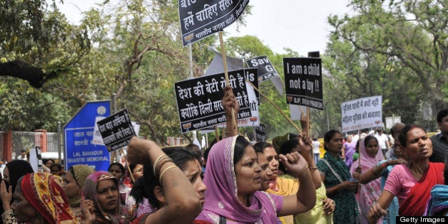 NEW DELHI, INDIA - APRIL 21: Activists of Bharatiya Janata Party shouts anti Government slogans outside the UPA Chairperson Sonia Gandhi's residence during a demonstration against the rape of a five-year old girl on April 21, 2013 in New Delhi, India. A five year girl went missing on April 15 and was found on April 17 in same building where she lives with her parents. She was found in serious condition after being brutally raped and tortured with slashed neck and bite marks on her body. The man who lives in that room was arrested in Bihar state on April 20. (Photo by Vipin Kumar/Hindustan Times via Getty Images)