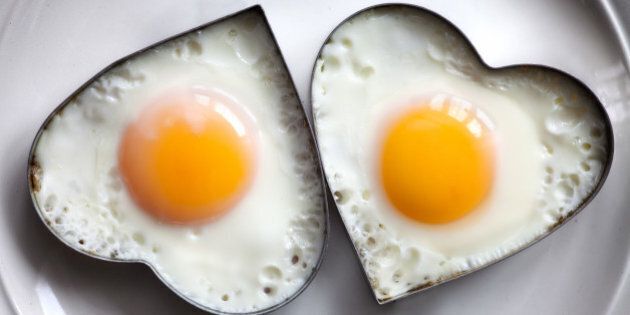 fried egg on heart shaped .