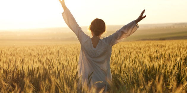 woman with arms outstretched in ...