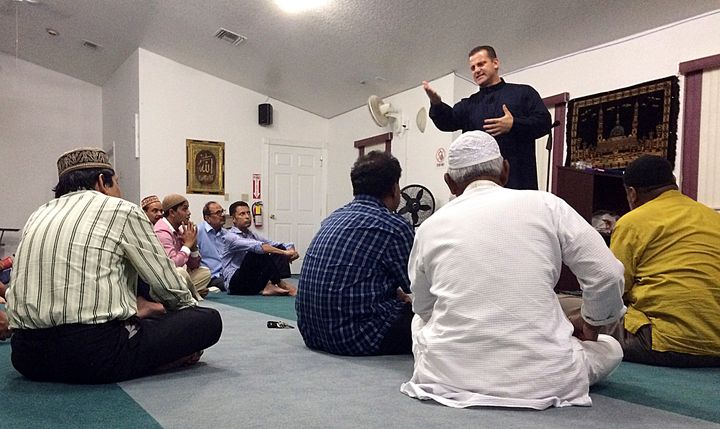 Sheriff's Deputy Nezar Hamze teaches members of the Baitul Mukarram Mosque in Lake Worth, Florida, how to defend themselves if a shooter attacks their worship service.
