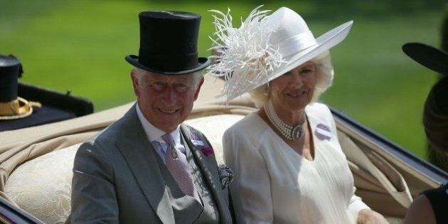 Britain's Prince Charles, Prince of Wales (L) and his wife Britain's Camilla, Duchess of Cornwall travel by horse-drawn carriage to arrive on day one of the Royal Ascot horse racing meet, in Ascot, west of London, on June 20, 2017.The five-day meeting is one of the highlights of the horse racing calendar. Horse racing has been held at the famous Berkshire course since 1711 and tradition is a hallmark of the meeting. Top hats and tails remain compulsory in parts of the course while a daily procession of horse-drawn carriages brings the Queen to the course. / AFP PHOTO / Daniel LEAL-OLIVAS (Photo credit should read DANIEL LEAL-OLIVAS/AFP/Getty Images)