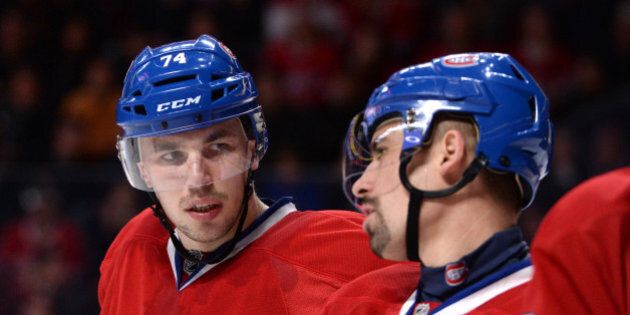 MONTREAL, QC - APRIL 12: Alexei Emelin #74 and Tomas Plekanec #14 of the Montreal Canadiens exchanges words during the NHL game against the New York Rangers on April 12, 2014 at the Bell Centre in Montreal, Quebec, Canada. (Photo by Francois Lacasse/NHLI via Getty Images)