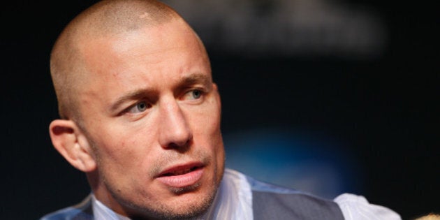 LAS VEGAS, NV - NOVEMBER 14: UFC welterweight champion Georges St-Pierre interacts with media during the final UFC 167 pre-fight press conference inside the Hollywood Theatre at the MGM Grand Hotel/Casino on November 14, 2013 in Las Vegas, Nevada. (Photo by Josh Hedges/Zuffa LLC/Zuffa LLC via Getty Images)