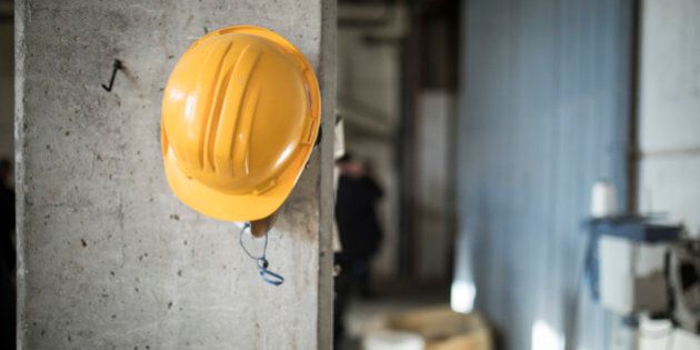 NAFPLION, GREECE - NOVEMBER 04: A protective helmet hangs on a column on a construction site on November 04, 2016 in Nafplion, Greece. (Photo by Florian Gaertner/Photothek via Getty Images)